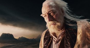 Movie still from “The Imaginarium of Doctor Parnassus” (2009), directed by Terry Gilliam – An old man with a long white beard; Close Up shot, Low angle