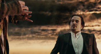 Movie still from “The Imaginarium of Doctor Parnassus” (2009), directed by Terry Gilliam – A man standing in front of a hand reaching out to another man; Close Up shot, Over the shoulder angle