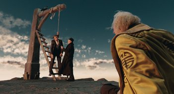 Movie still from “The Imaginarium of Doctor Parnassus” (2009), directed by Terry Gilliam – Two people standing next to each other on a rope ladder; Wide shot, Low angle