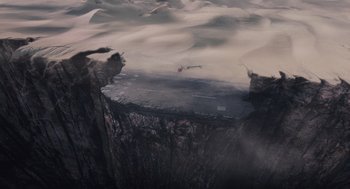 Movie still from “The Imaginarium of Doctor Parnassus” (2009), directed by Terry Gilliam – An aerial view of a plane flying in the sky; Extreme Wide shot, Overhead angle