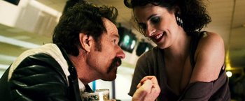 Movie still from “The Infiltrator” (2016), directed by Brad Furman – A man and a woman sitting at a table talking to each other; Close Up shot, Over the shoulder angle