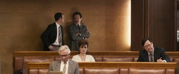 Movie still from “The Infiltrator” (2016), directed by Brad Furman – Three men and a woman sitting in a court room; Wide shot, Over the shoulder angle