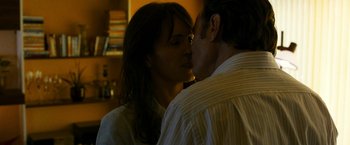 Movie still from “The Infiltrator” (2016), directed by Brad Furman – A man and a woman are kissing in a room; Close Up shot, Over the shoulder angle