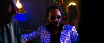 Movie still from “The Infiltrator” (2016), directed by Brad Furman – A man with a beard wearing a jacket and sunglasses; Close Up shot, Low angle