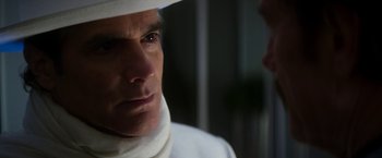 Movie still from “The Infiltrator” (2016), directed by Brad Furman – A person wearing a white hat; Close Up shot, Over the shoulder angle