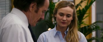 Movie still from “The Infiltrator” (2016), directed by Brad Furman – A man and a woman standing next to each other; Close Up shot, Over the shoulder angle