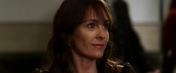 Movie still from “The Infiltrator” (2016), directed by Brad Furman – A person with long hair; Close Up shot, Over the shoulder angle