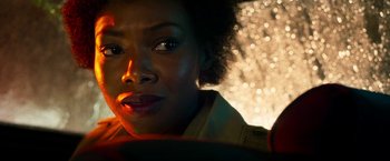 Movie still from “The Infiltrator” (2016), directed by Brad Furman – A woman's face in the dark; Close Up shot, Over the shoulder angle