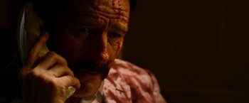 Movie still from “The Infiltrator” (2016), directed by Brad Furman – A person with a bandage on his head; Close Up shot, Low angle