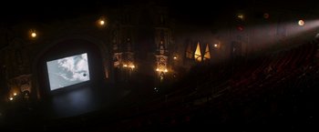 Movie still from “The Infiltrator” (2016), directed by Brad Furman – A dark picture of a theatre with lights on; Extreme Wide shot, High angle