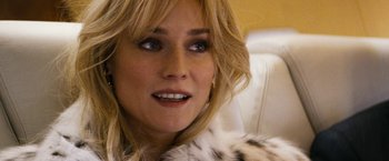 Movie still from “The Infiltrator” (2016), directed by Brad Furman – A woman's face in a fur coat; Close Up shot, Over the shoulder angle