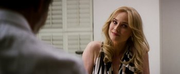 Movie still from “The Infiltrator” (2016), directed by Brad Furman – A woman sitting in front of a mirror looking at the camera; Close Up shot, Over the shoulder angle