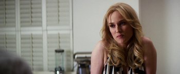 Movie still from “The Infiltrator” (2016), directed by Brad Furman – A woman with long blonde hair sitting in front of a mirror; Close Up shot, Over the shoulder angle