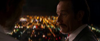 Movie still from “The Infiltrator” (2016), directed by Brad Furman – A person looking at the camera; Close Up shot, Over the shoulder angle
