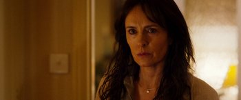 Movie still from “The Infiltrator” (2016), directed by Brad Furman – A person with long hair; Close Up shot, Over the shoulder angle