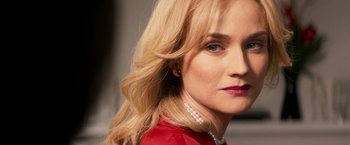 Movie still from “The Infiltrator” (2016), directed by Brad Furman – A person wearing a red shirt; Close Up shot, Over the shoulder angle