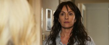 Movie still from “The Infiltrator” (2016), directed by Brad Furman – A person with long black hair; Close Up shot, Over the shoulder angle