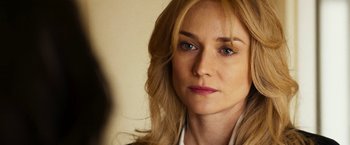 Movie still from “The Infiltrator” (2016), directed by Brad Furman – A person with long blonde hair; Close Up shot, Over the shoulder angle