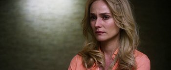 Movie still from “The Infiltrator” (2016), directed by Brad Furman – A person with long blonde hair; Close Up shot, Over the shoulder angle