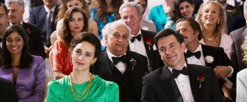 Movie still from “The Infiltrator” (2016), directed by Brad Furman – A group of men and women in formal wear; Close Up shot, Over the shoulder angle
