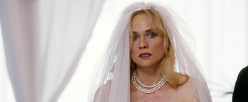Movie still from “The Infiltrator” (2016), directed by Brad Furman – A woman wearing a wedding veil and a tiara; Close Up shot, Over the shoulder angle