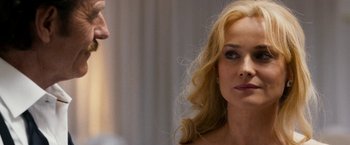 Movie still from “The Infiltrator” (2016), directed by Brad Furman – A man and a woman looking at one another; Close Up shot, Over the shoulder angle