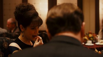 Movie still from “The Informant!” (2009), directed by Steven Soderbergh – A woman is looking in the mirror and brushing her teeth; Close Up shot, Over the shoulder angle