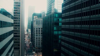 Movie still from “The Informant!” (2009), directed by Steven Soderbergh – A view of a city from a high rise building; Extreme Wide shot, High angle