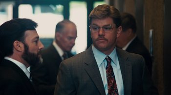 Movie still from “The Informant!” (2009), directed by Steven Soderbergh – A man in a suit and tie; Close Up shot, Over the shoulder angle