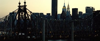 Movie still from “The International” (2009), directed by Tom Tykwer – A view of a city skyline at night; Extreme Wide shot, High angle
