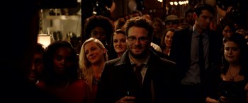 Movie still from “The Interview” (2014), directed by Evan Goldberg – A group of people standing in front of each other; Medium shot, Over the shoulder angle