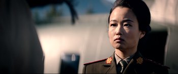 Movie still from “The Interview” (2014), directed by Evan Goldberg – A woman in a military uniform is looking at the camera; Close Up shot, Low angle