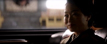 Movie still from “The Interview” (2014), directed by Evan Goldberg – A woman sitting in the back seat of a car; Close Up shot, Over the shoulder angle