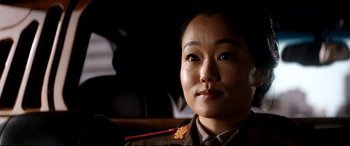Movie still from “The Interview” (2014), directed by Evan Goldberg – A person wearing a military uniform; Close Up shot, Over the shoulder angle