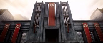 Movie still from “The Interview” (2014), directed by Evan Goldberg – A large building with a red star on the front of it; Extreme Wide shot, Low angle