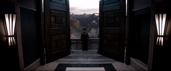 Movie still from “The Interview” (2014), directed by Evan Goldberg – A man in uniform standing in front of a window; Wide shot, Low angle