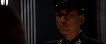 Movie still from “The Interview” (2014), directed by Evan Goldberg – A person wearing a uniform; Close Up shot, Low angle