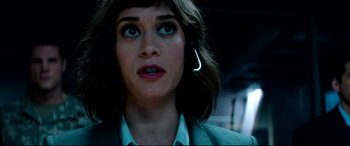 Movie still from “The Interview” (2014), directed by Evan Goldberg – A person with a cell phone in her ear; Close Up shot, Overhead angle