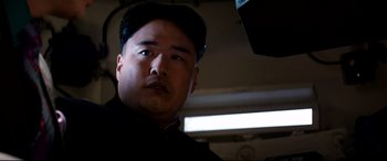 Movie still from “The Interview” (2014), directed by Evan Goldberg – A person wearing a hat and looking at the camera; Close Up shot, Low angle