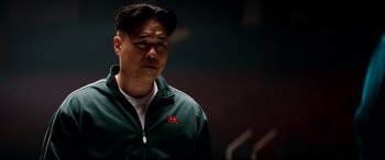 Movie still from “The Interview” (2014), directed by Evan Goldberg – A man in a green jacket is looking down; Close Up shot, Low angle