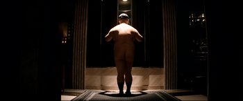 Movie still from “The Interview” (2014), directed by Evan Goldberg – A man standing in front of a mirror in a bath room; Wide shot, Low angle