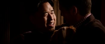 Movie still from “The Interview” (2014), directed by Evan Goldberg – A person holding a teddy bear; Close Up shot, Over the shoulder angle