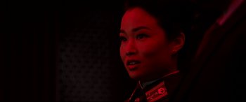 Movie still from “The Interview” (2014), directed by Evan Goldberg – A woman in military uniform looking into the distance; Close Up shot, Low angle