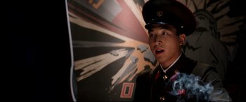 Movie still from “The Interview” (2014), directed by Evan Goldberg – A man in a military uniform standing in front of a painting; Close Up shot, Low angle