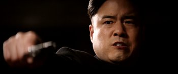 Movie still from “The Interview” (2014), directed by Evan Goldberg – A man's face in a dark room; Close Up shot, Low angle
