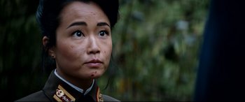 Movie still from “The Interview” (2014), directed by Evan Goldberg – A person wearing a military uniform; Close Up shot, Over the shoulder angle