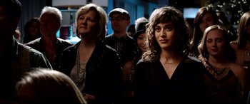 Movie still from “The Interview” (2014), directed by Evan Goldberg – A group of people standing in a room together; Close Up shot, Over the shoulder angle