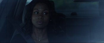 Movie still from “The Invitation” (2015), directed by Karyn Kusama – A woman sitting in the back of a car looking out the window; Close Up shot, Over the shoulder angle