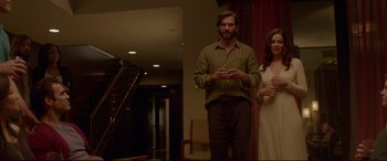 Movie still from “The Invitation” (2015), directed by Karyn Kusama – A man and a woman standing next to each other in a room; Medium shot, Low angle