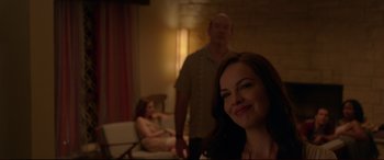 Movie still from “The Invitation” (2015), directed by Karyn Kusama – A man and a woman in a living room; Medium shot, Over the shoulder angle